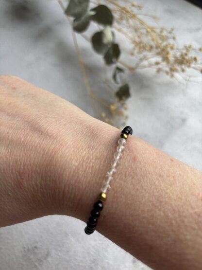 Onyx en bergkristal armband